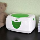 Young father talking to newborn baby relaxing on changing table
