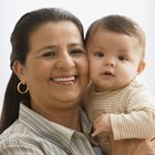 Portrait Of Father With Newborn Baby At Home