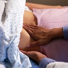 Doctor Taking Pregnant Womans Pulse