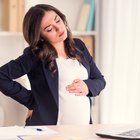 Pregnant Asian couple hugging