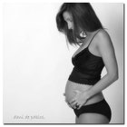 Woman's hand holding pregnancy test