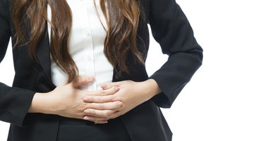 Stressed pregnant woman lying in bed