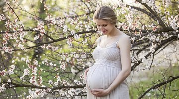Beautiful young pregnant woman smiling