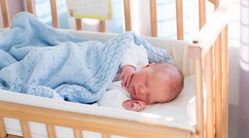 Newborn Girl Sleeping in Swaddle