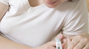 Mother Taking Temperature Of Sick Daughter