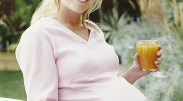 Beautiful young pregnant woman smiling