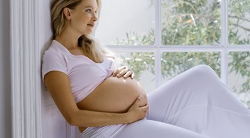 Pensive pregnant woman