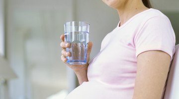 Pregnant woman with orange juice