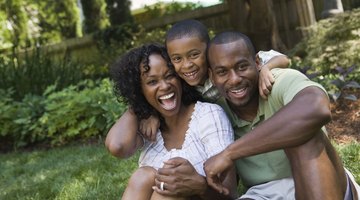 Couple arguing behind their children