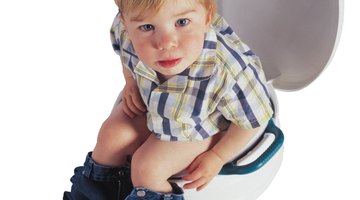 Girl Reading a Book on a Potty Chair