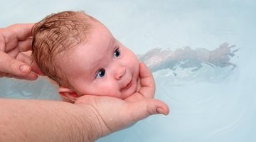 Mother giving son a bath