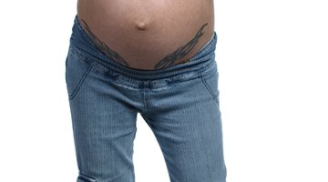 Pregnant woman smiling outdoors