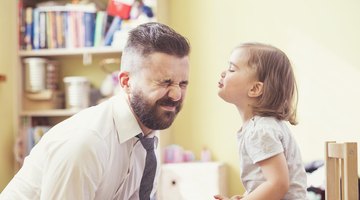 Close-up of a father face to face with his daughter