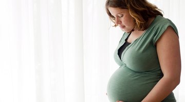 Beautiful young pregnant woman smiling