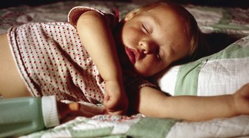 Newborn baby sleeping on the bed