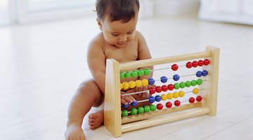 Girl playing with numbered cubes