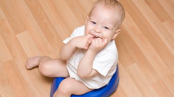 Girl Reading a Book on a Potty Chair