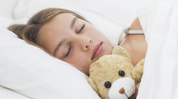 Boy sleeping in bed