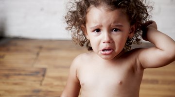 Boy holding missing teeth