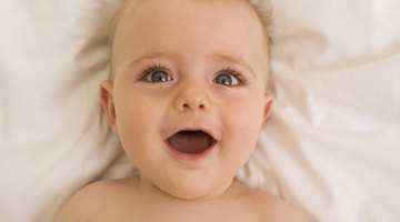 Crying baby comforted by woman