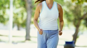 Cropped pregnant woman touching belly
