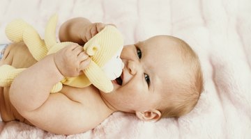 Baby boy with his first toys