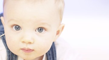 Manual breast pump and milk at background
