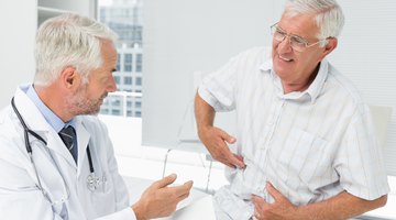 Pregnant woman discussing with female doctor