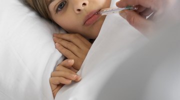 Mother reading bedtime story to daughter