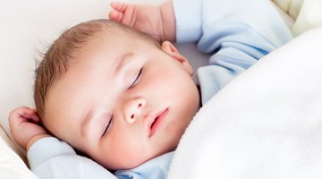Newborn Girl Sleeping in Swaddle