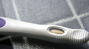 woman honding negative pregnancy test