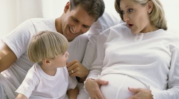 Newborn baby lying on a white background