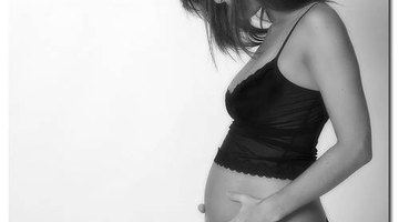 Woman's hand holding pregnancy test 